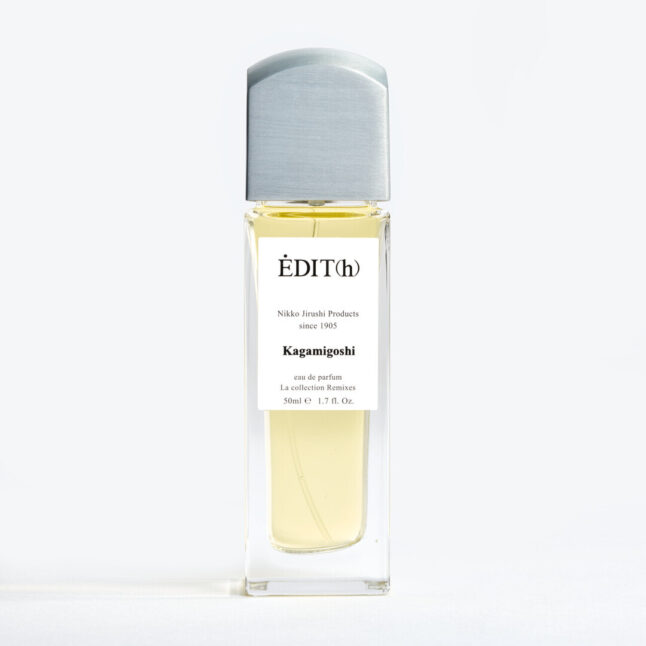 A tall rectangular perfume with a metal lid with EDIT(h) Nikko Jirushi Products since 1905 Kagamigoshi on the label