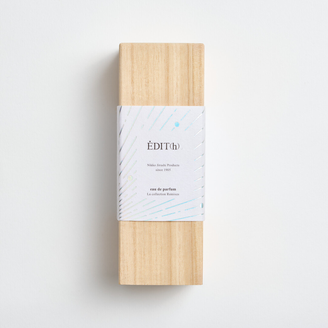 A rectangular wooden box with a label and the EDIT(h) Nikko Jirushi Products since 1905 on the label in a wooden box