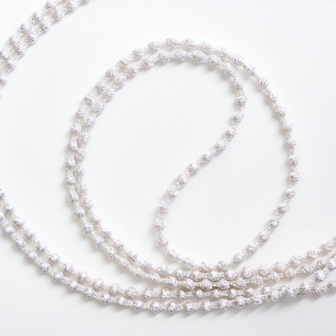 A silver textile necklace of a chain of small spheres