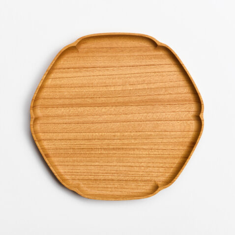A wooden tray shaped as a snowflake