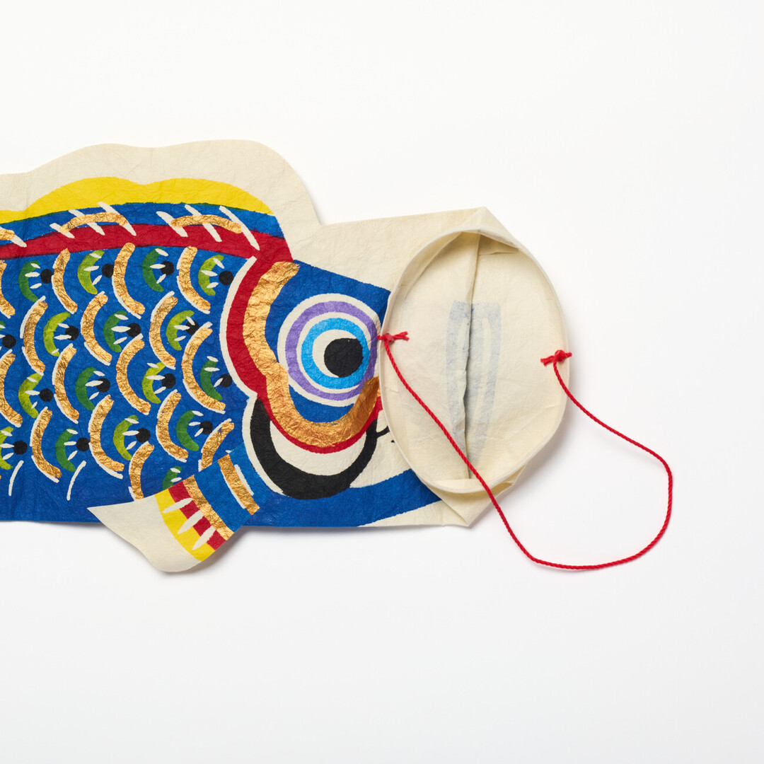 A blue washi koinobori with a folded opening