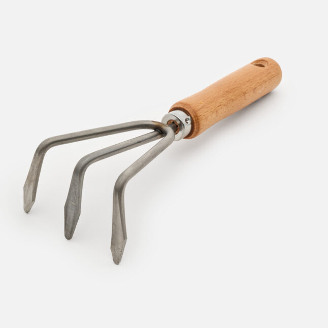 The hand rake with a wooden handle