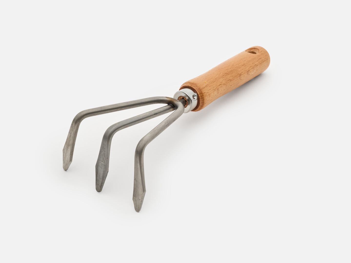 The hand rake with a wooden handle
