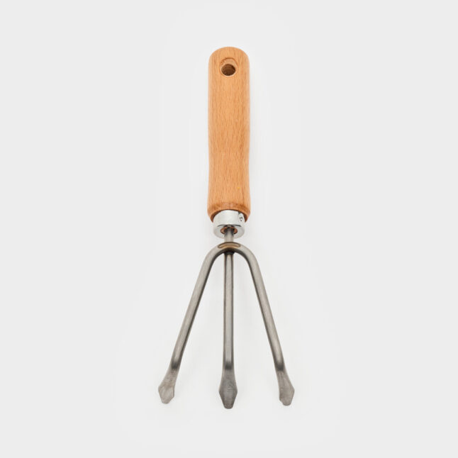 The hand rake with a wooden handle