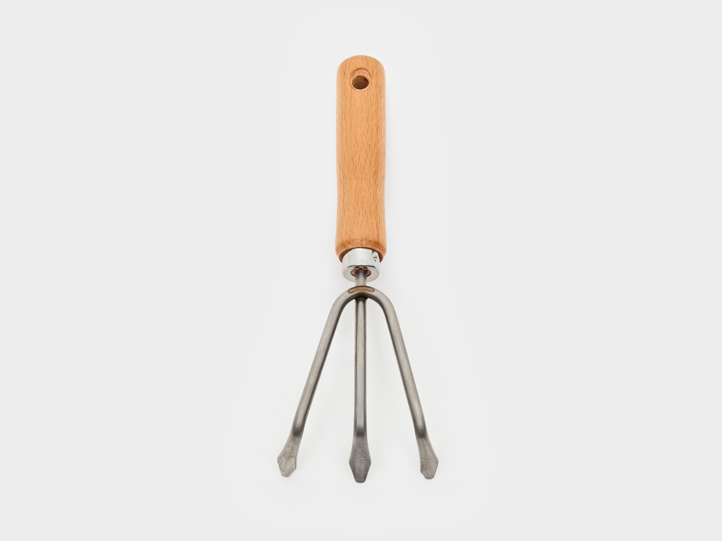 The hand rake with a wooden handle