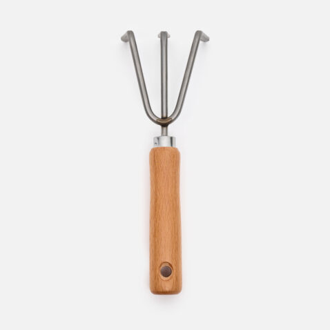 The hand rake with a wooden handle