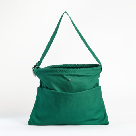 A green tote bag filled