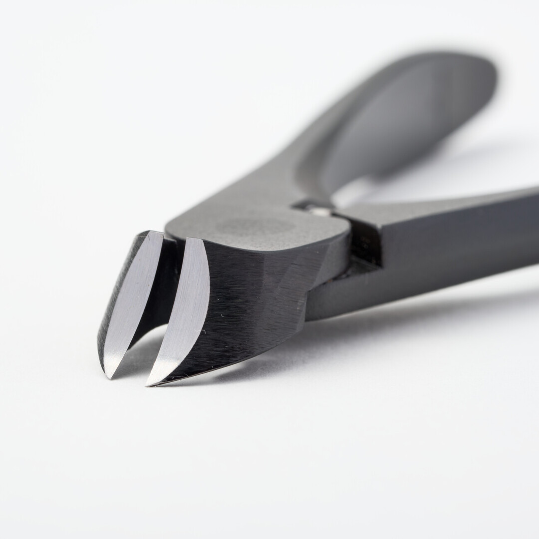 Sharpened blades of black nail nippers