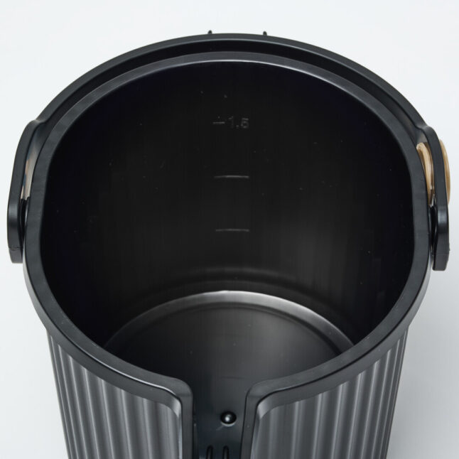 A measure of water inside the black watering can.