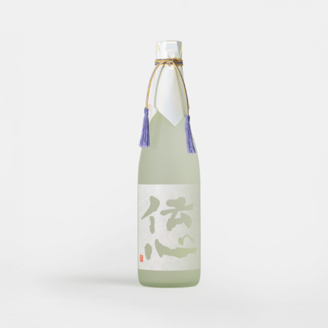 A white bottle with a white label with the words, Denshin and golden threads tied to the lid with purple tassels