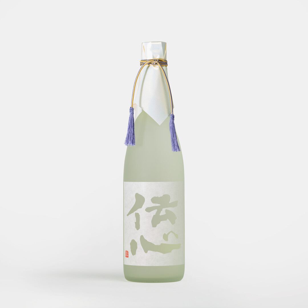 A white bottle with a white label with the words, Denshin and golden threads tied to the lid with purple tassels