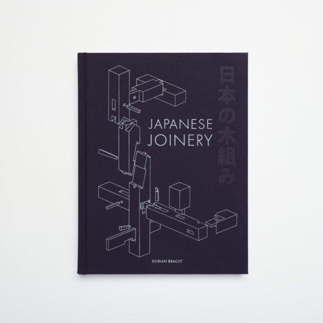 A navy blue book with the words Japanese Joinery and illustrations of joints in white