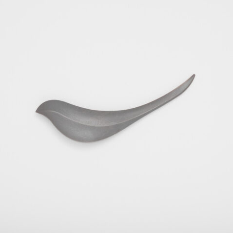 A grey bird shaped letter opener