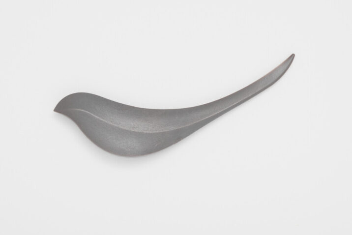 A grey bird shaped letter opener