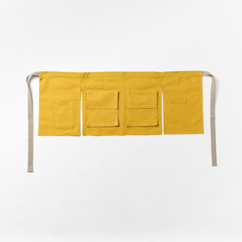 The front of the yellow hannoren apron with pockets and straps for tools