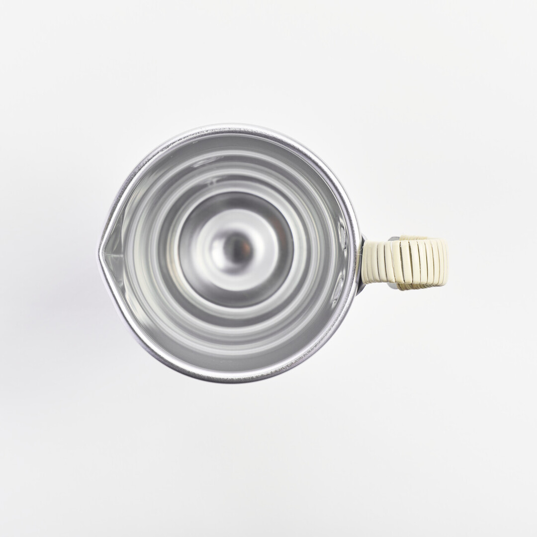 An aluminium sake pitcher with a bamboo wrapped handle