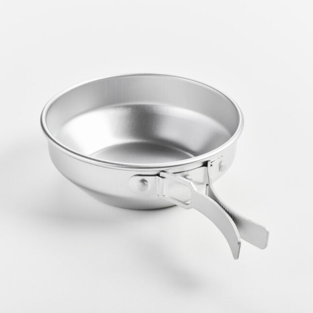 A aluminium pot with foldable handles open