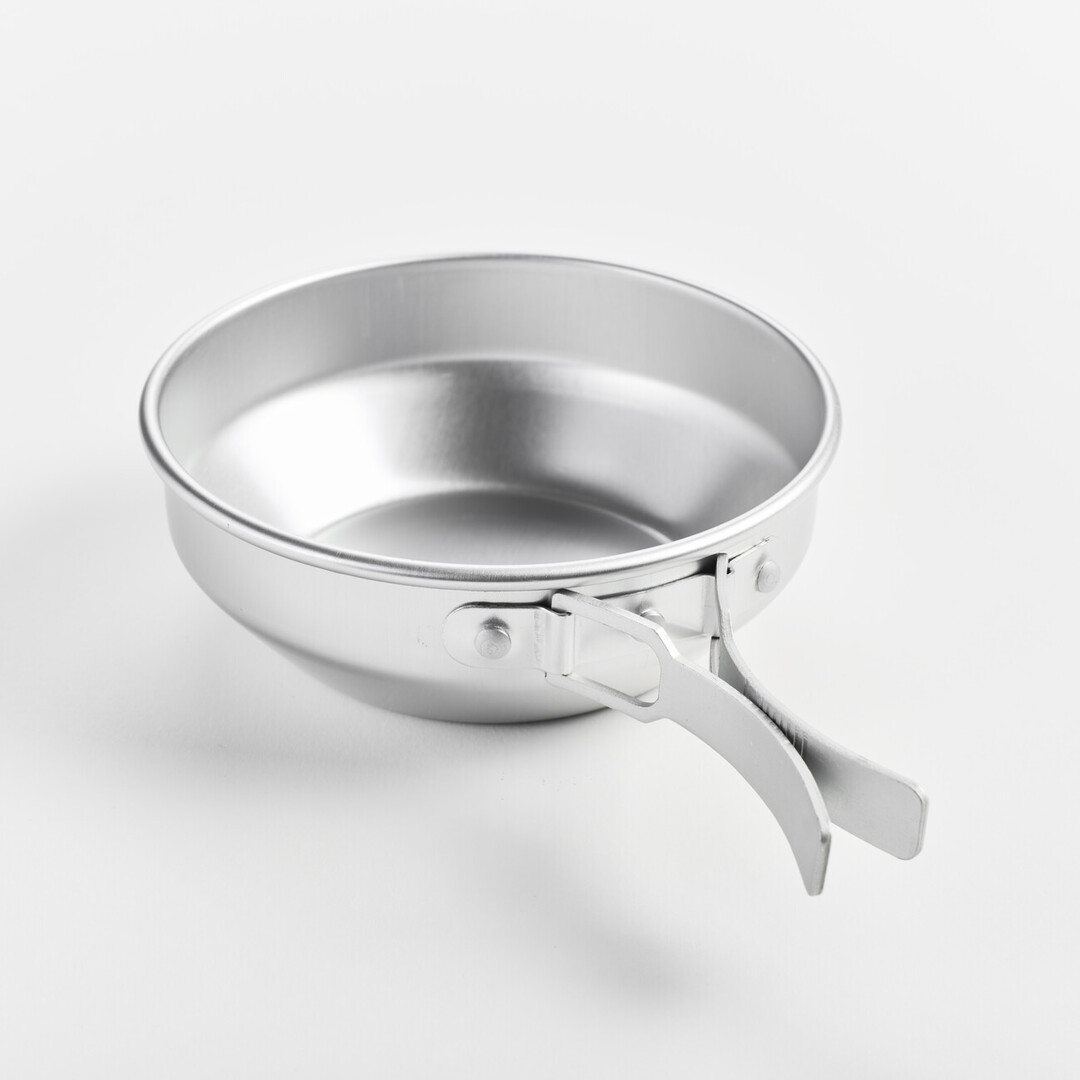 A aluminium pot with foldable handles open