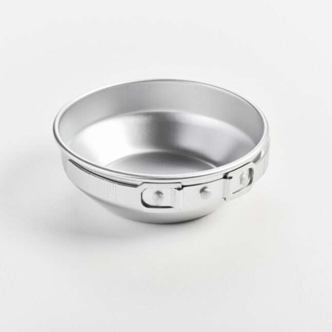 A aluminium pot with foldable handles collapsed