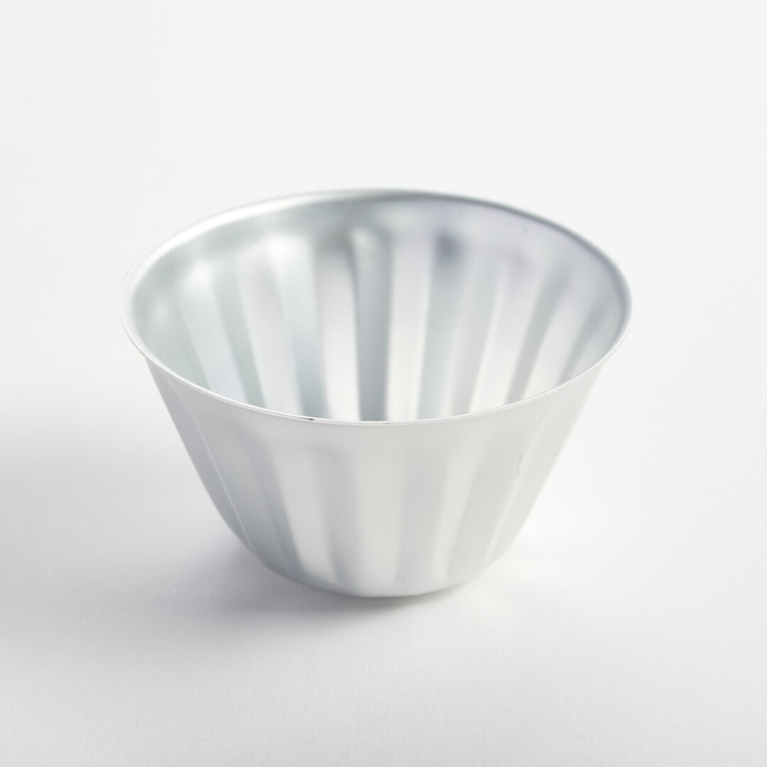 A small aluminium jelly mould