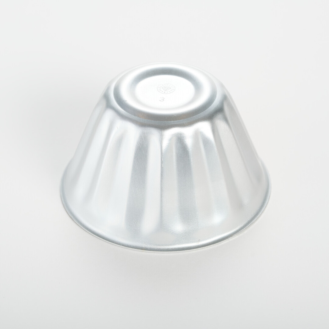 A small aluminium jelly mould