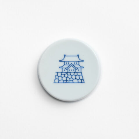 The Arita porcelain magnet with a blue line drawing of the Imperial Palace