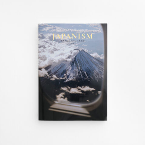 A book with an aerial view of Mount Fuji from an airplane with Japanism in gold letters