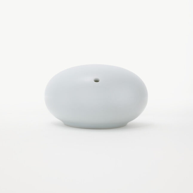 White Hakusan Porcelain salt shaker with rounded shape inspired by pebbles