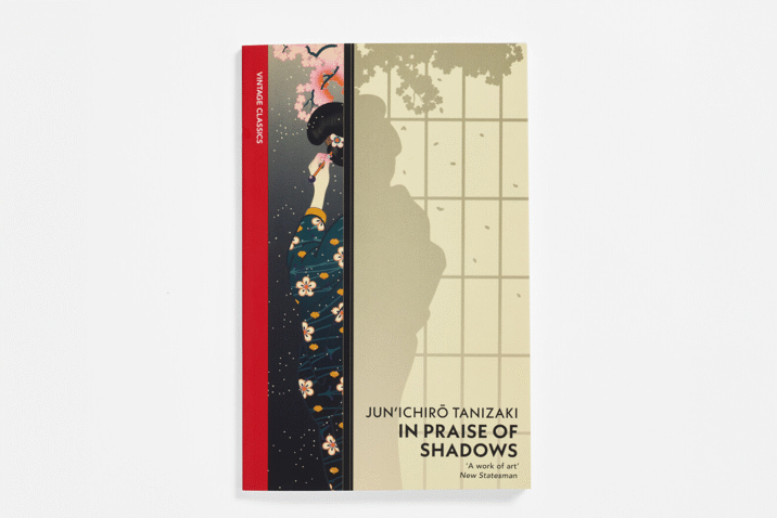 In Praise of Shadows cover with a woman in a kimono standing behind a screen with her back towards the viewer