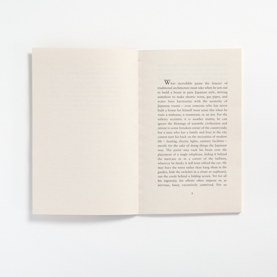 The opening page of book, In Praise of Shadow on the right hand side with the left hand side empty