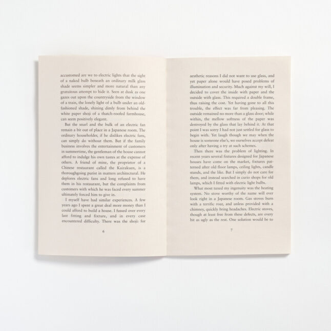 An open spread of book, In Praise of Shadow