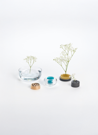 A collection of kenzan, flower frogs made with glass, metal, plastic and bamboo charcoal