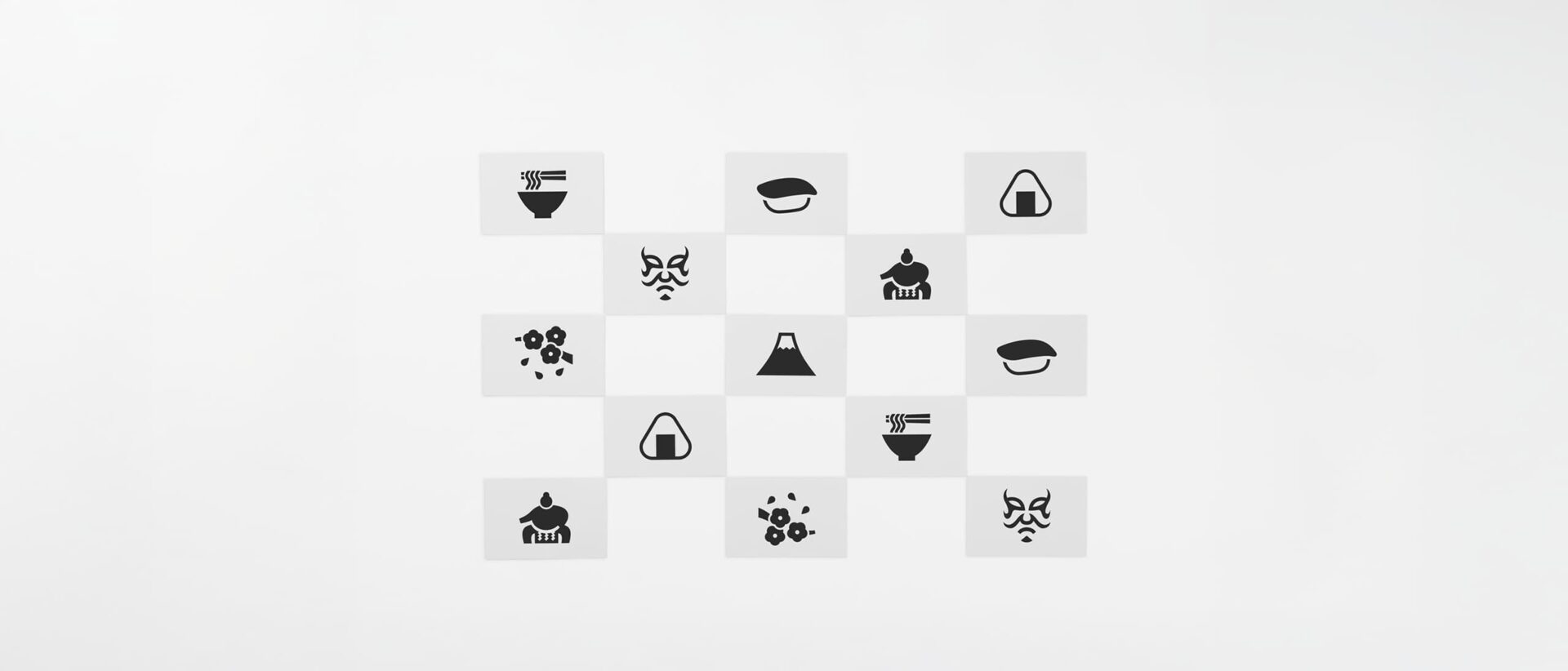 Thirteen black and white postcards with pictograms from Japan placed in a chequered formation