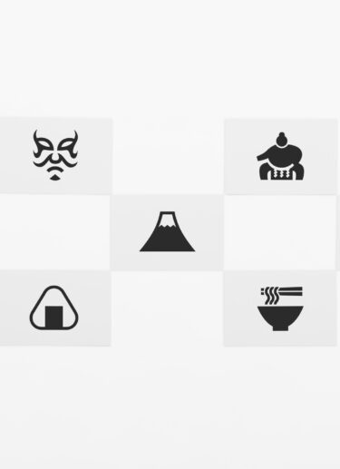 Seven black and white postcards with pictograms from Japan placed in a chequered formation