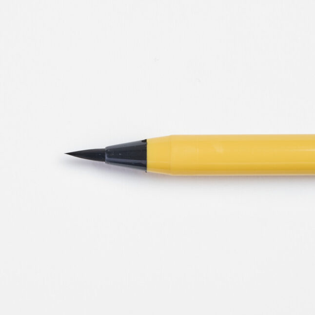 A brush tip of the soft tip pen with yellow body