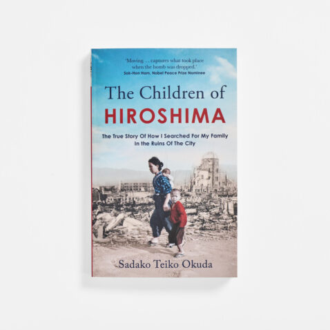 The front page of Open page of the book The Children of Hiroshima: The True Story Of How I Searched For My Family In The Ruins Of The City with a woman carrying a small child on her back and holding the hand of a small child through rubble