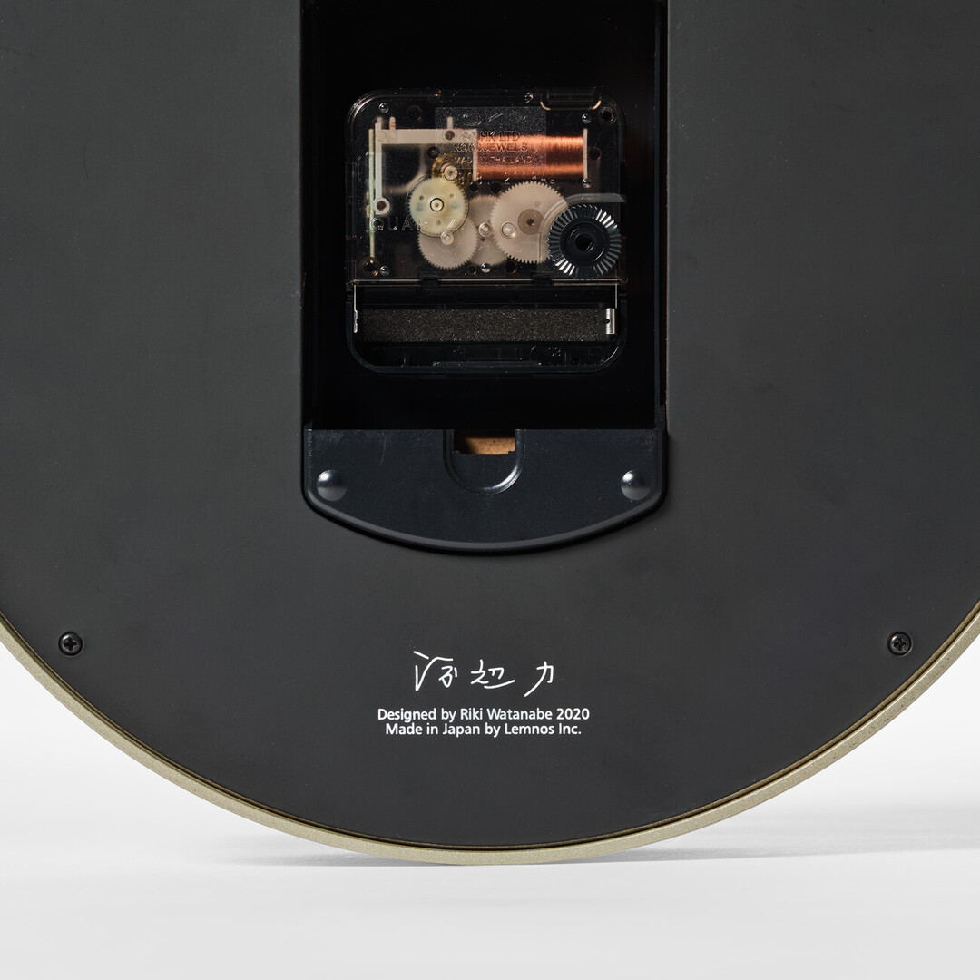The back of the Riki Ring Clock with the signature of the deisgner Watanabe Riki