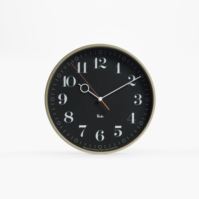The black wall Riki Ring Clock with silver frame
