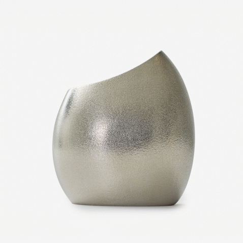 A tin vase shaped like a cocoon from Nousaku