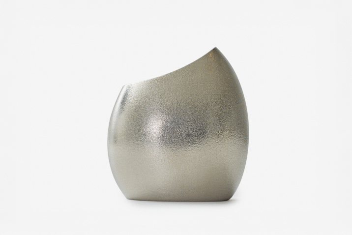 A tin vase shaped like a cocoon from Nousaku