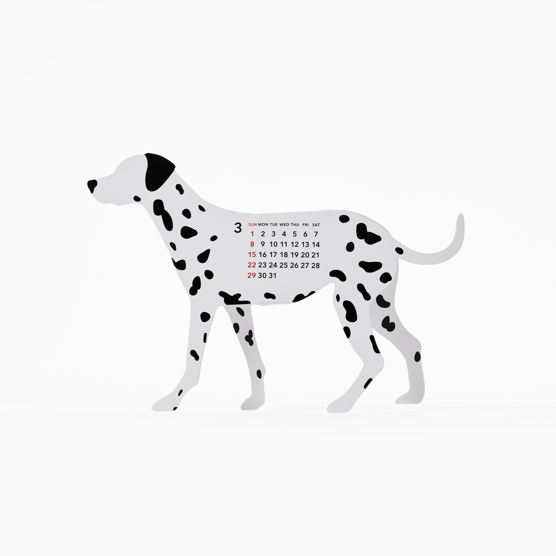 A paper calendar in the shape of a Dalmatian, showing March on the side of the days of March on the body from Japan House London