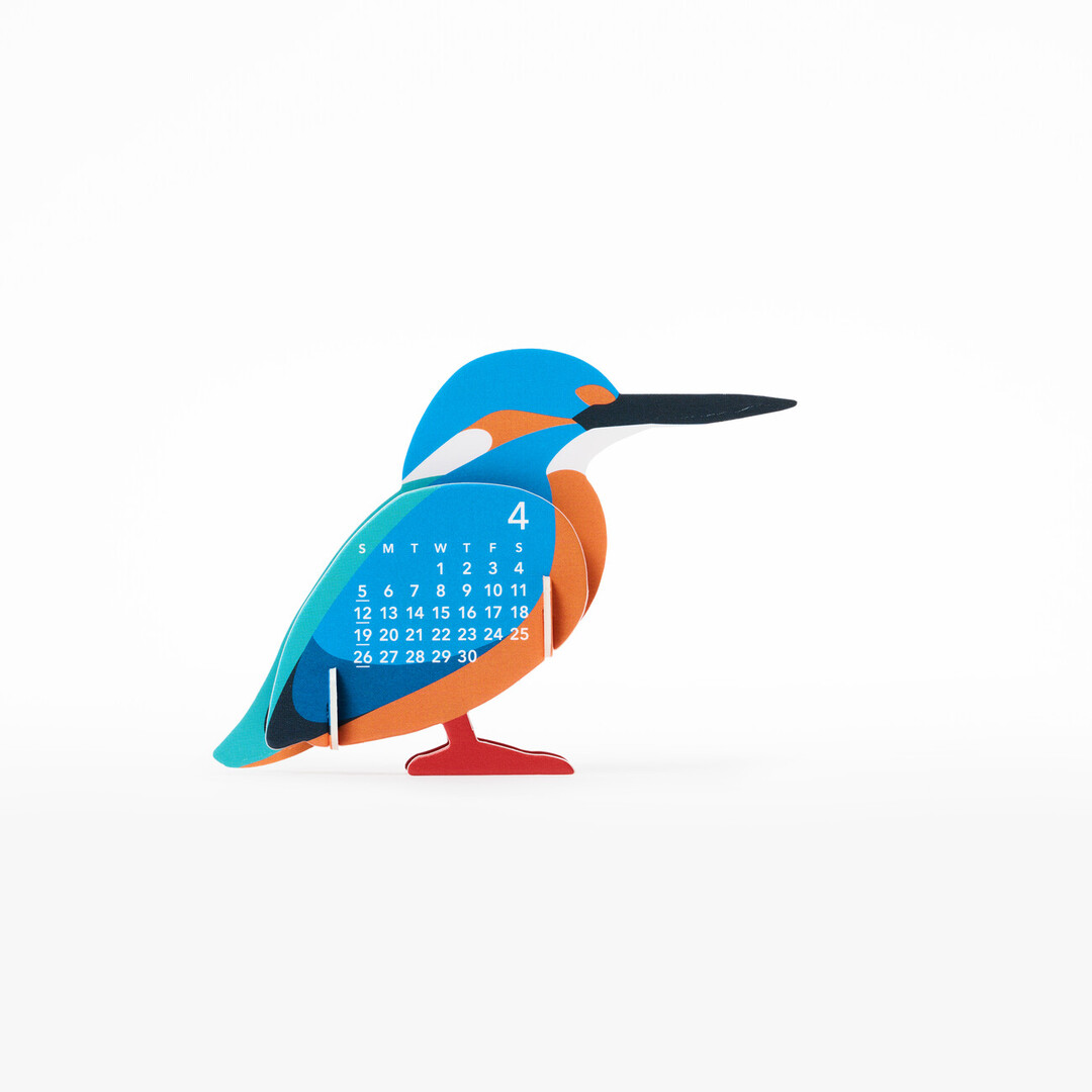 A three dimensional paper calendar in the shape of a king fisher with the month of April on the side from Japan House London