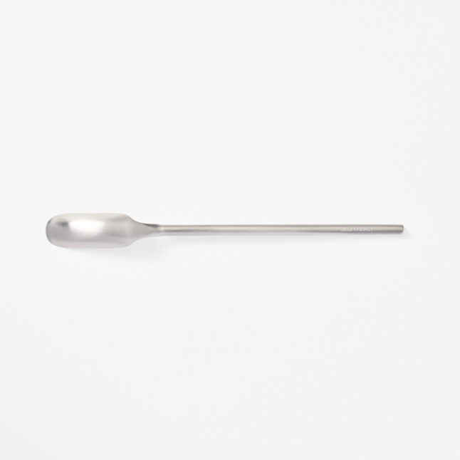 A stainless steel slim spoon with a long handle and narrow head from Japan House London