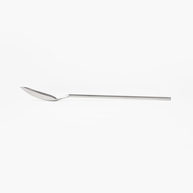 A stainless steel slim spoon with a long handle and narrow head from Japan House London