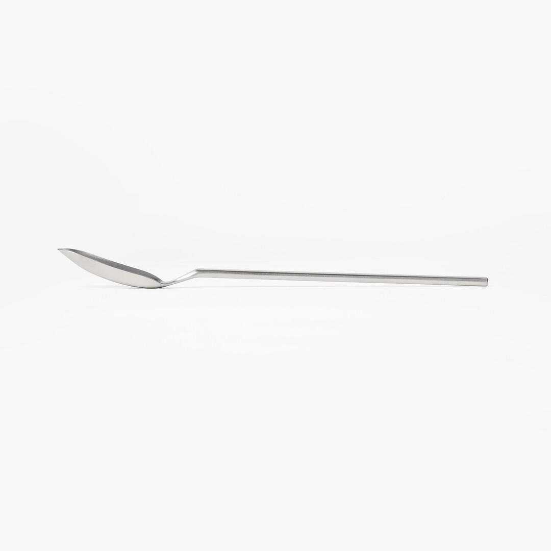 A stainless steel slim spoon with a long handle and narrow head from Japan House London