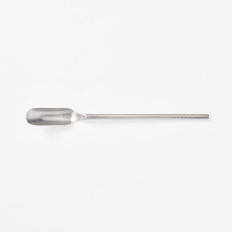 A stainless steel slim spoon with a long handle and narrow head from Japan House London