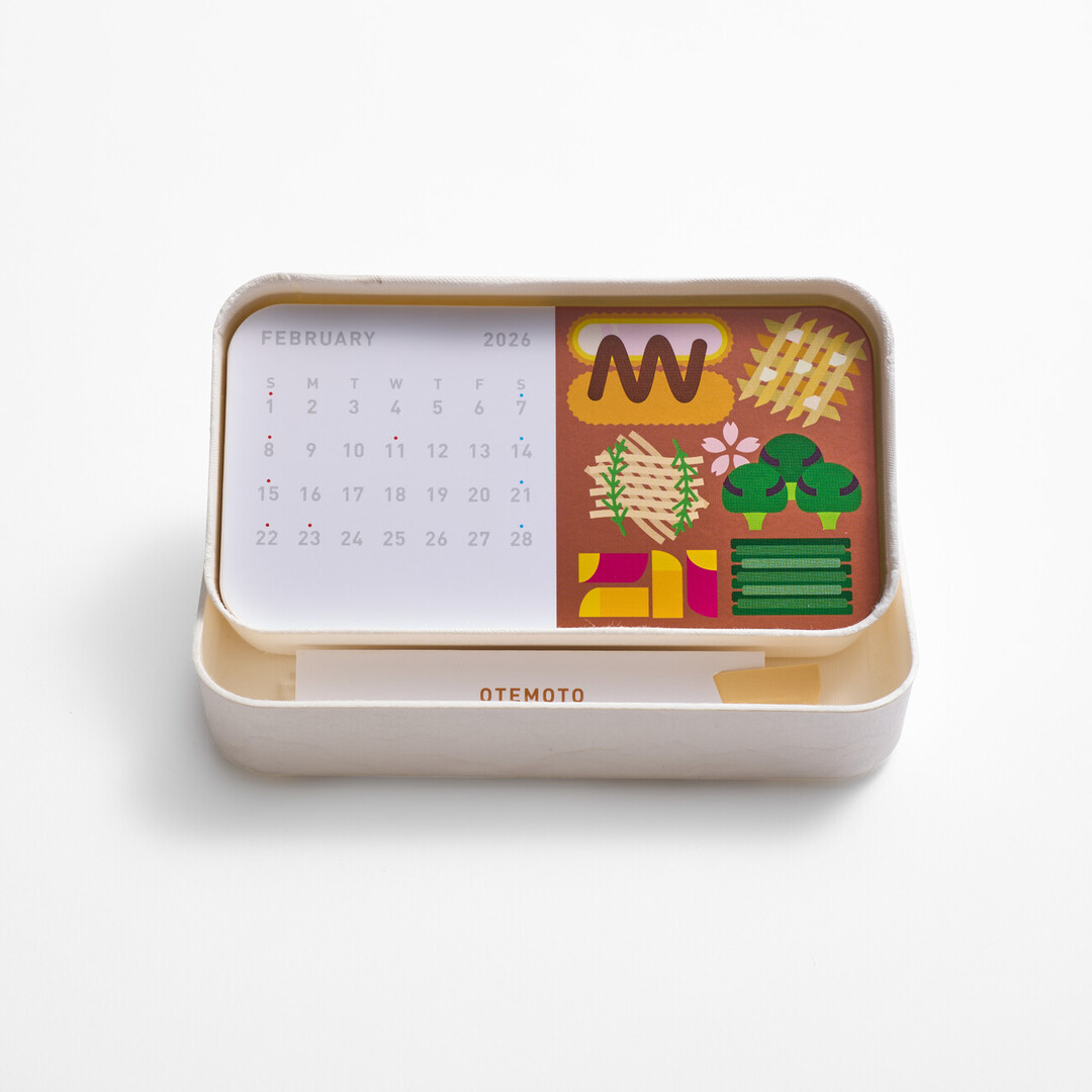 A bento box shaped calendar with chopsticks from Japan House London.