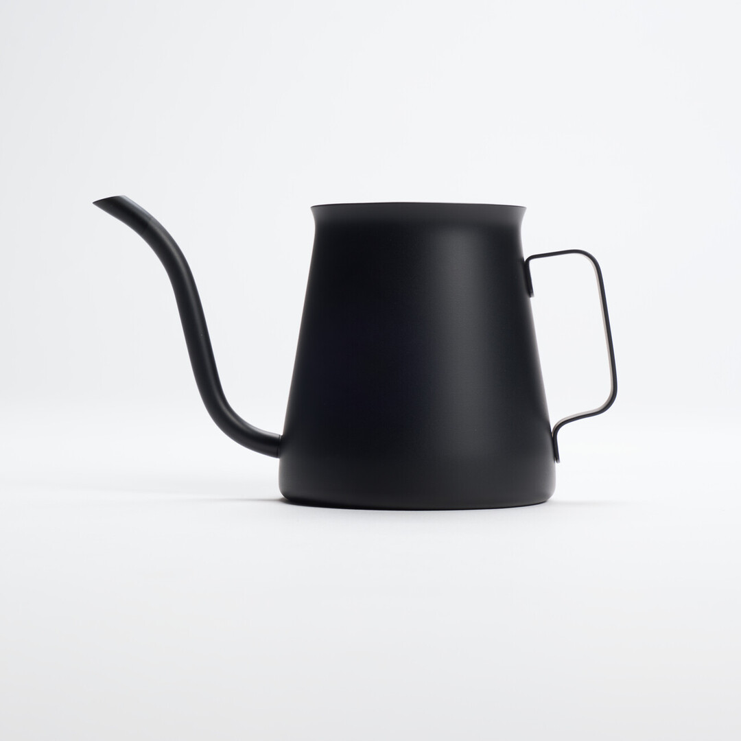 A black Hario Kasuya Mini Drip Kettle 300ml for pouring hot water over coffee grounds from Japan House London.