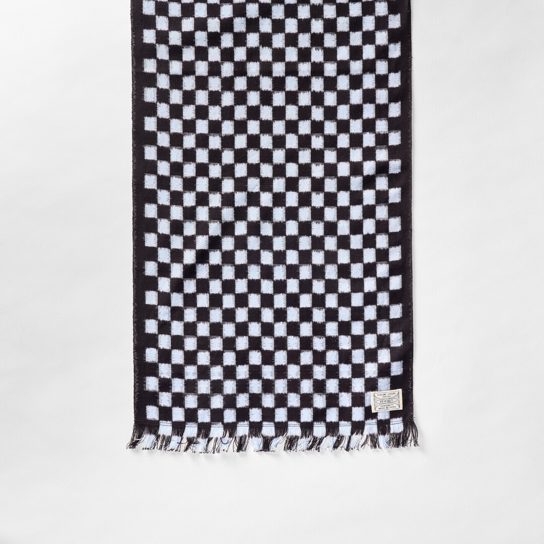 Kurume-kasuri shawl with an indigo pattern of small chequered pattern from Japan House London.