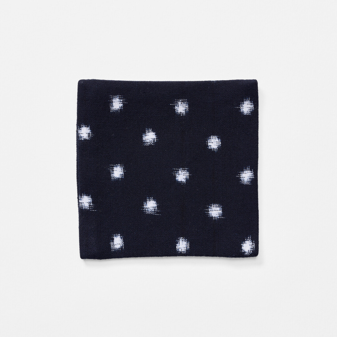Dark blue Kurume Kasuri coaster with white dots by Okamoto Shōten from Japan House London.